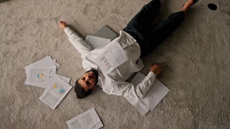 overworked businessman sleeping on the floor