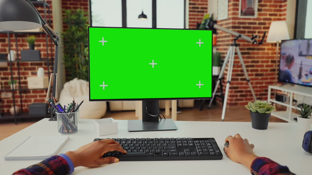 Office worker analyzing isolated greenscreen on computer
