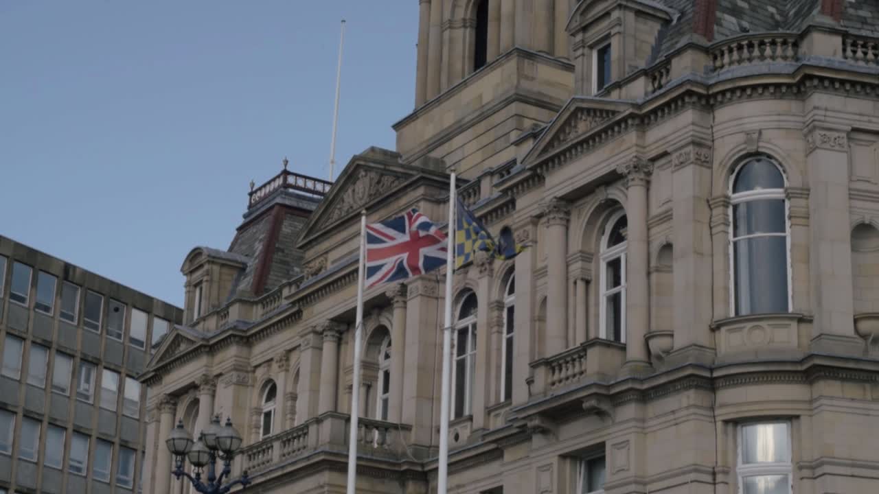 Dewsbury town hall with clock wide tilting shot