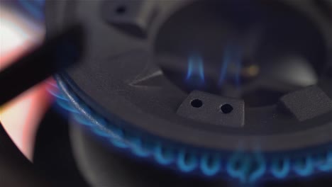 Igniting-a-gas-stove-burner-in-a-kitchen