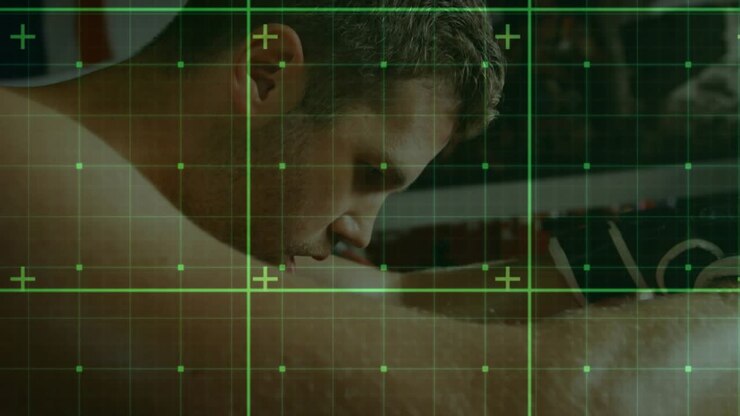 Male athlete leaning on rope, adjusting glove while green HUD tracking vitals, preparing for boxing