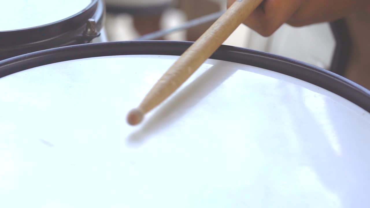 Drummer hitting drum slow motion