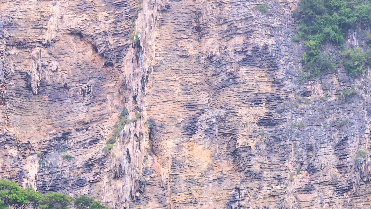 Rocky cliffs with lush greenery in Krabi, Thailand