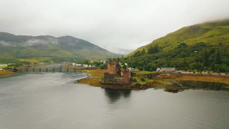 Cloudy-Sunrise-at-Eilean-Donan-Castle-on-Loch-Duich-in-the-Scottish-Highlands,-Scotland,-UK