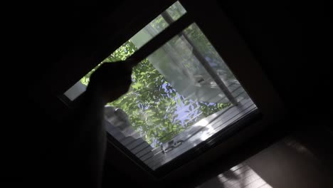 closing anti-insect mosquito net on a ceiling window to prevent insects and other bugs getting inside a campervan