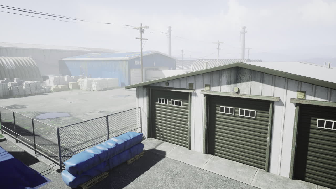 Industrial yard with storage units and containers under gray sky