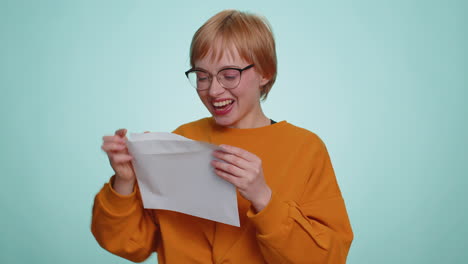 woman open envelope letter great news celebrate monetary award invitation bank loan approve