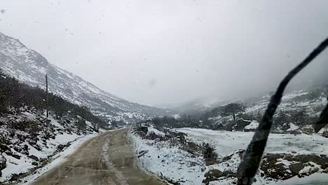 snowfall in himalayan snow cap mountains at morning