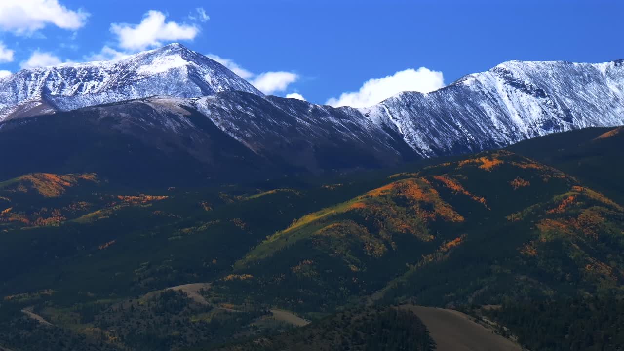 Mt Mount Shavano 14er Tabeguache Peak aerial drone upwards Colorado trail Sawatch Range fall autumn aspen trees San Isabel National Forest snow dusting morning vibrant blue sky clouds