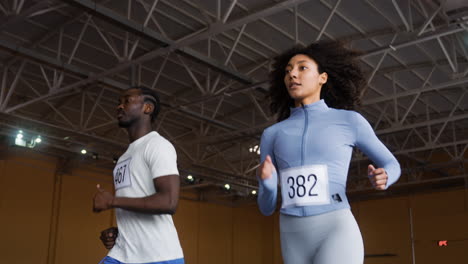 Man-and-woman-running-indoors