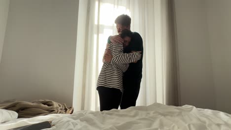 Couple interacting in a bedroom