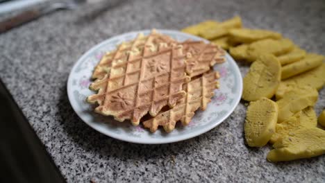 homemade pizzelle waffles on plate - popular italian dessert