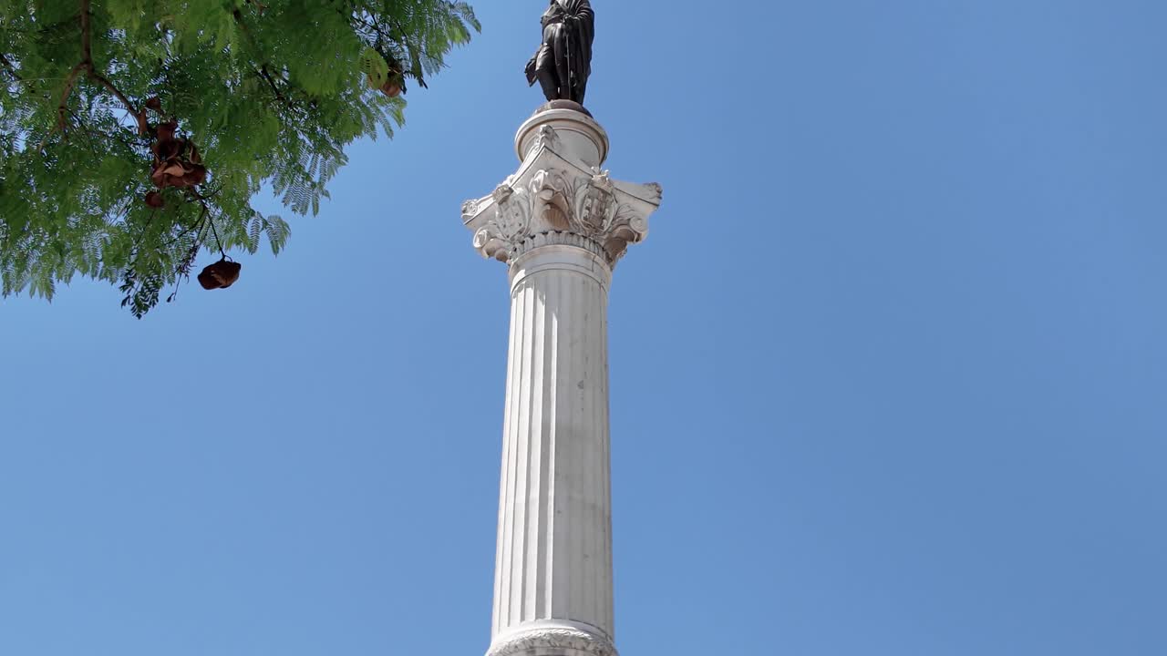 Majestic Column of Pedro IV under blue sky in Lisbon Portugal