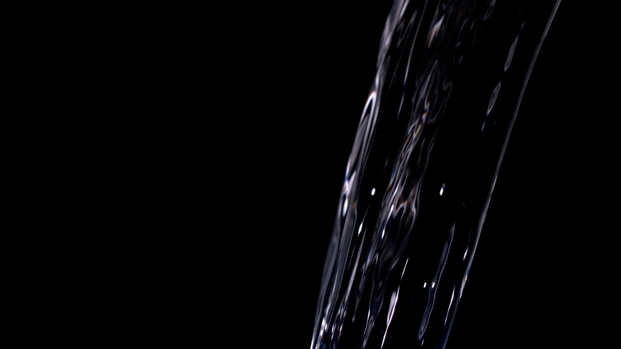 Water pouring against black background