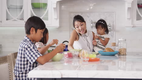 busy mother organizing children at breakfast shot on r3d