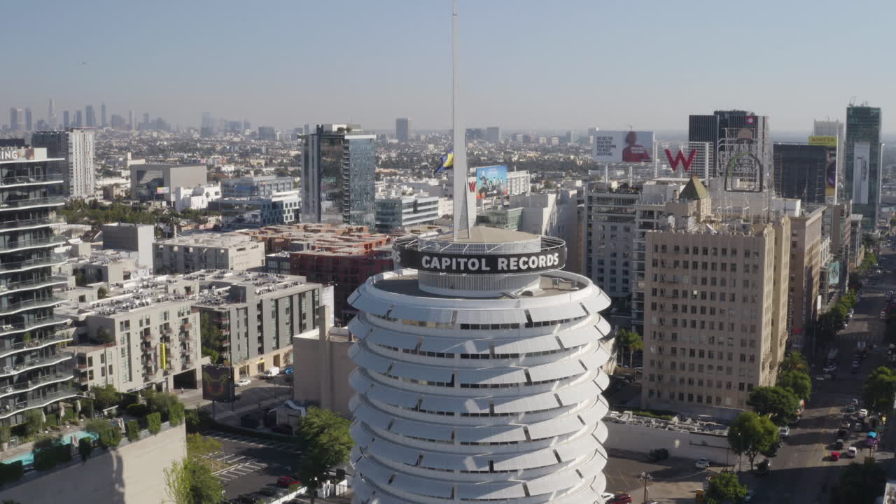 Pull back from the top of the Capitol Records Building in Hollywood California.
