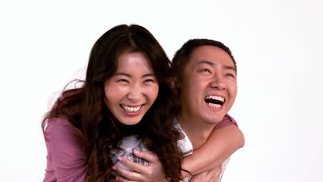 enamoured couple enjoying piggyback ride