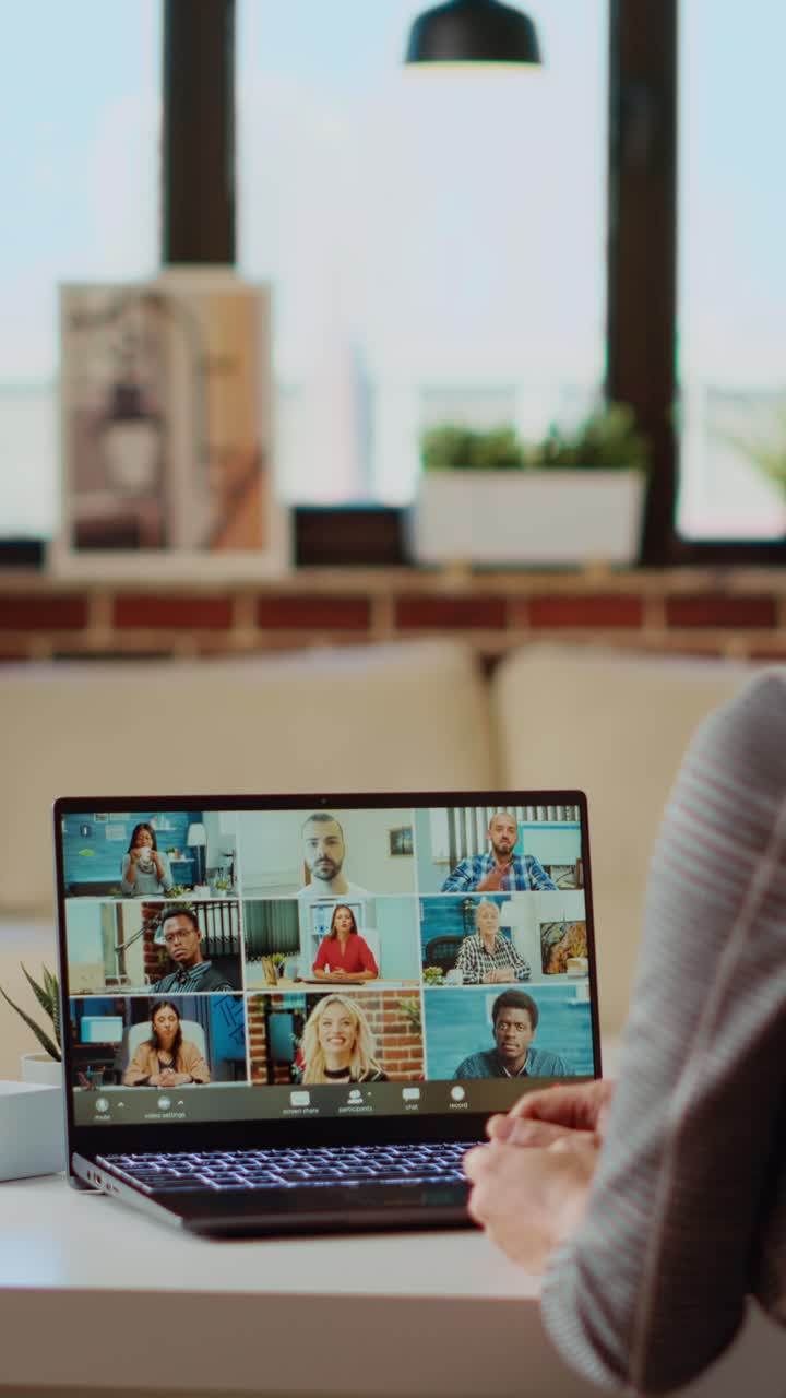 Vertical video Manager holding online videocall with remotely working employees
