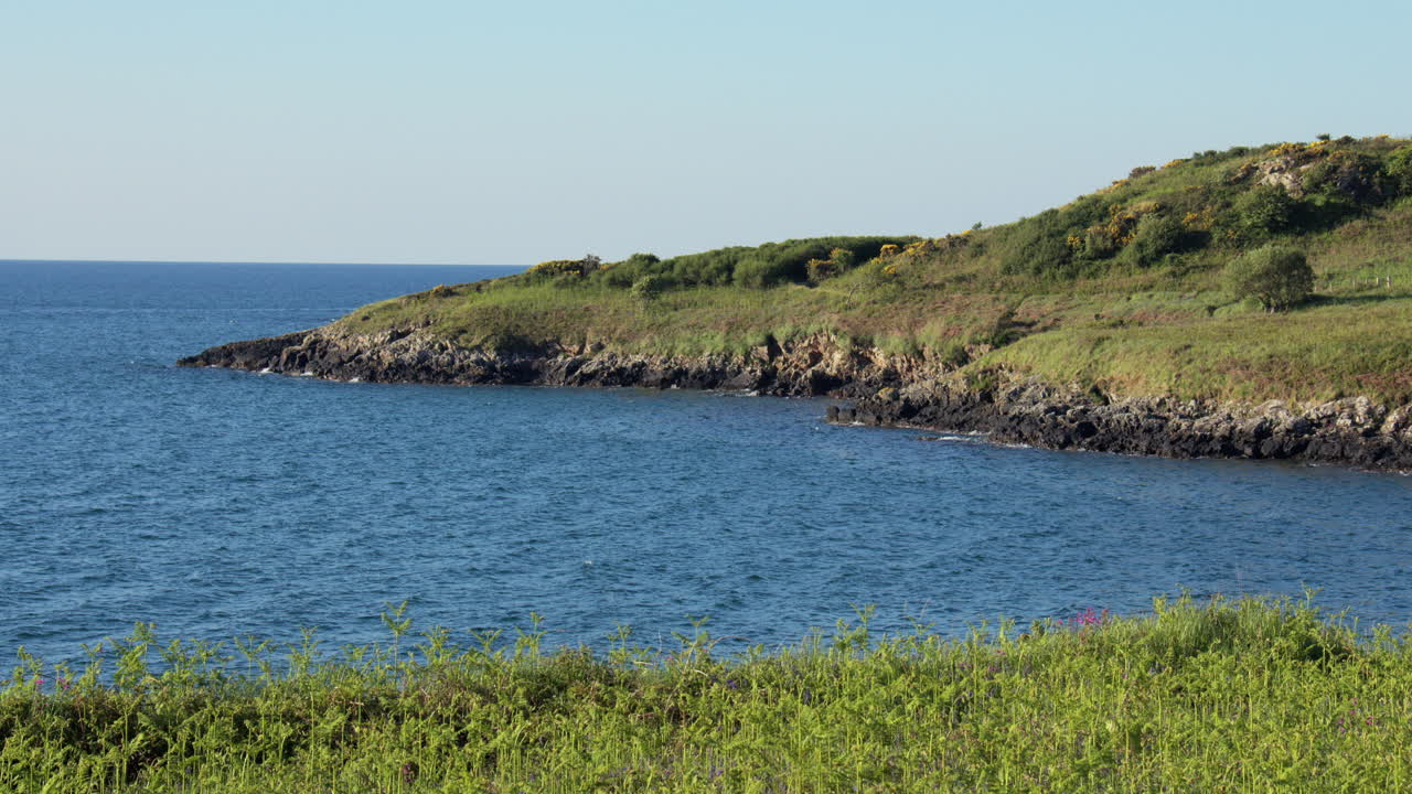 wide shot Looking south on the rocky Shoreline at Hafan y Môr on Pen-y-chain, Pwllheli