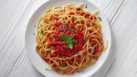 Delicious-Spaghetti-Pasta-With-Tomato-Sauce-On-White-Plate