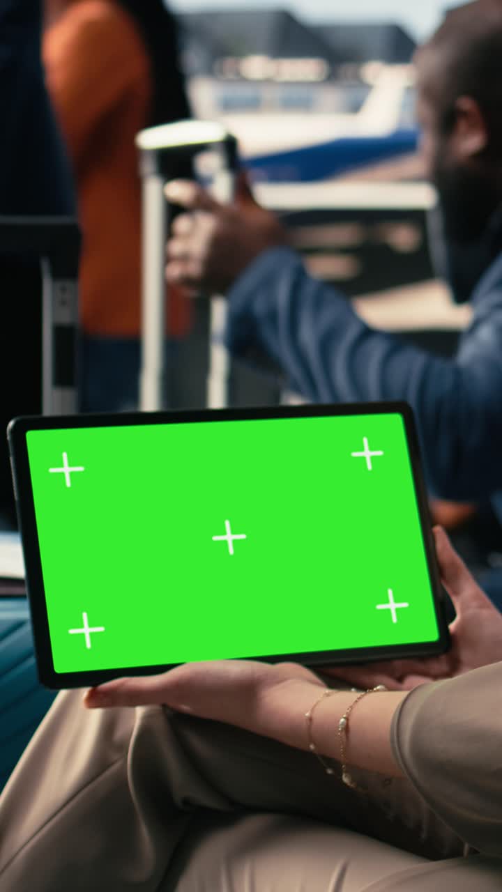 Vertical Video Chroma Key Mockup On Tablet With Group Of People Waiting In Airport Lounge