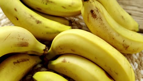 fresh bananas on wooden plank