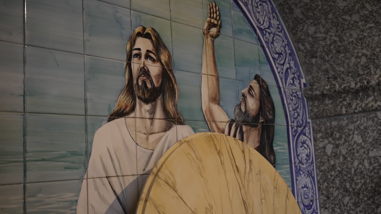 Traditional Portuguese azulejo depicting the baptism of Jesus Christ