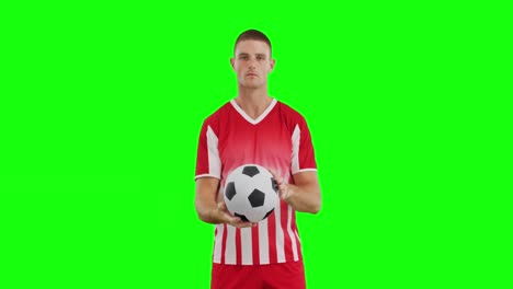 Video-of-caucasian-male-soccer-player-with-ball-on-green-screen-background