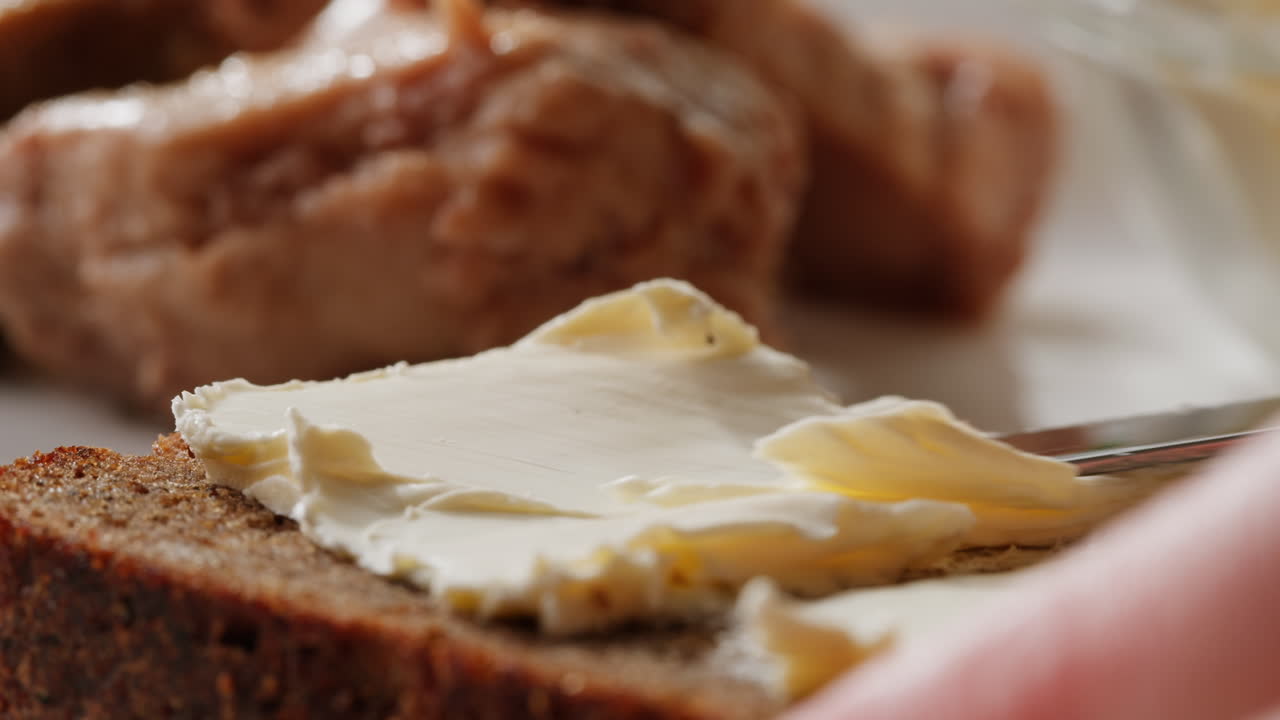 Smoked cod liver in oil in open tin can with fresh greens on wooden table. Seafoods delicacy. High quality 4k footage