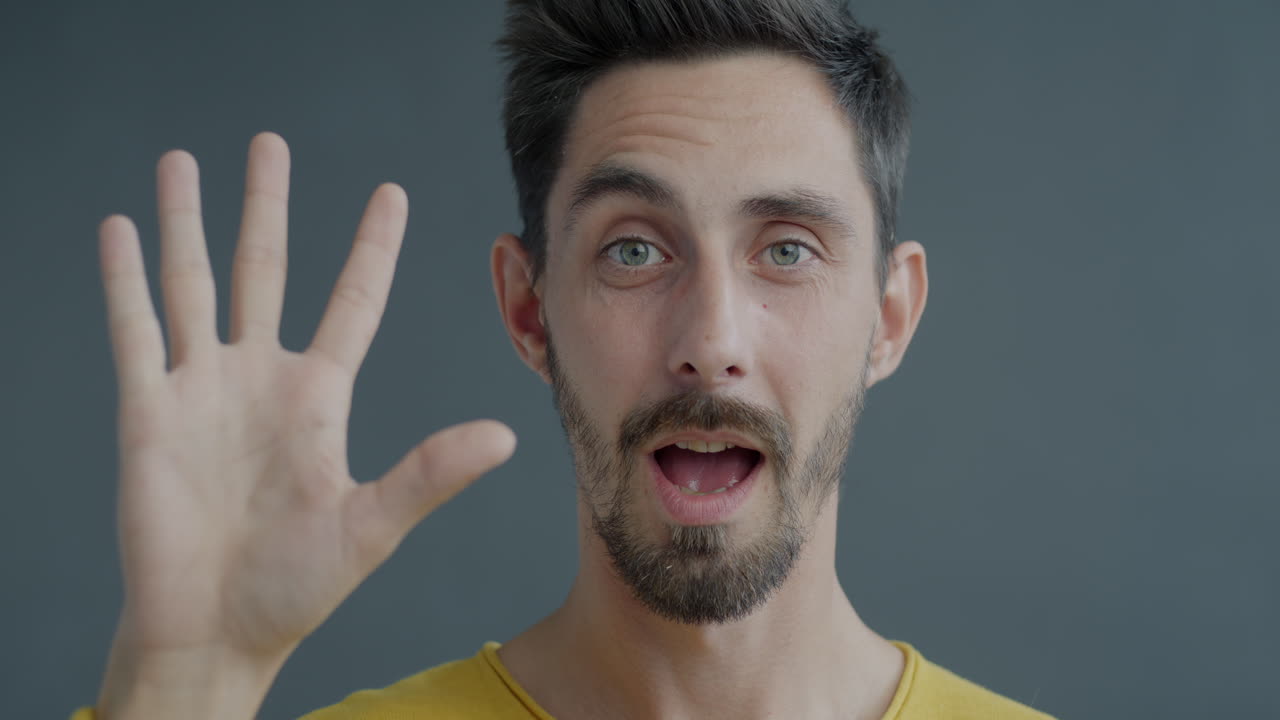 Man Pointing and Showing Five Fingers