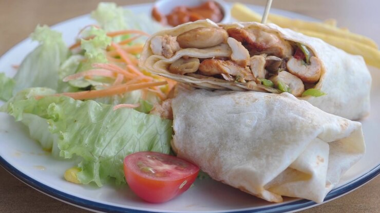 Chicken Wrap Served with Fresh Salad and French Fries
