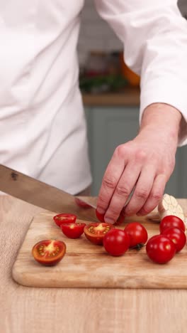 chef chopping cherry tomatoes