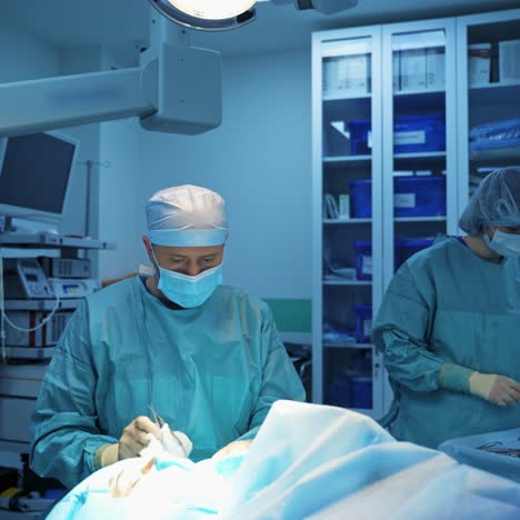 team of doctors doing blepharoplasty. nurse prepares medical tools for operation. plastic surgery on a patient's face in clinic.