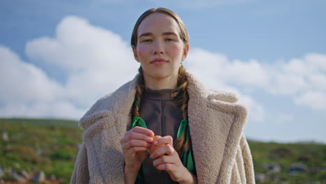 farm girl peeling egg on rural field closeup. smiling eco woman posing sunlight