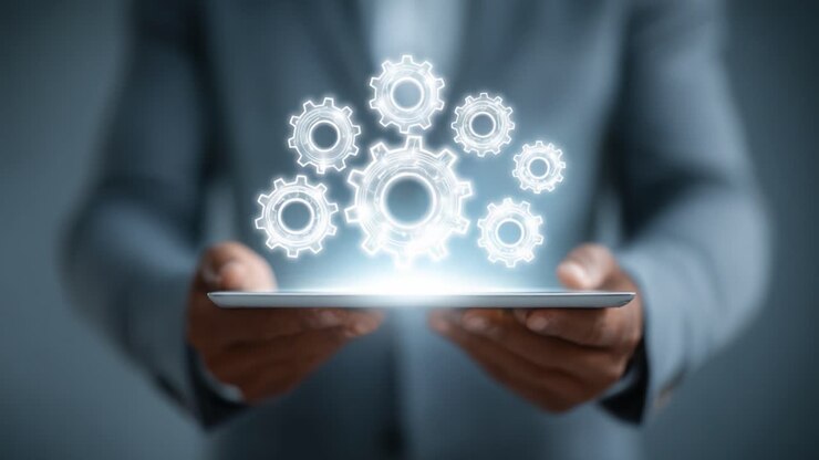 A Professional in a Suit Manipulating Digital Gears on a Tablet, Representing Technology, Innovation, and Automation in Modern Business Solutions