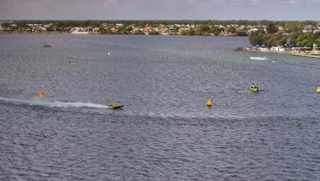 yellow racing boat turning close to a buoy on lake mulwala for e c griffith cup practice