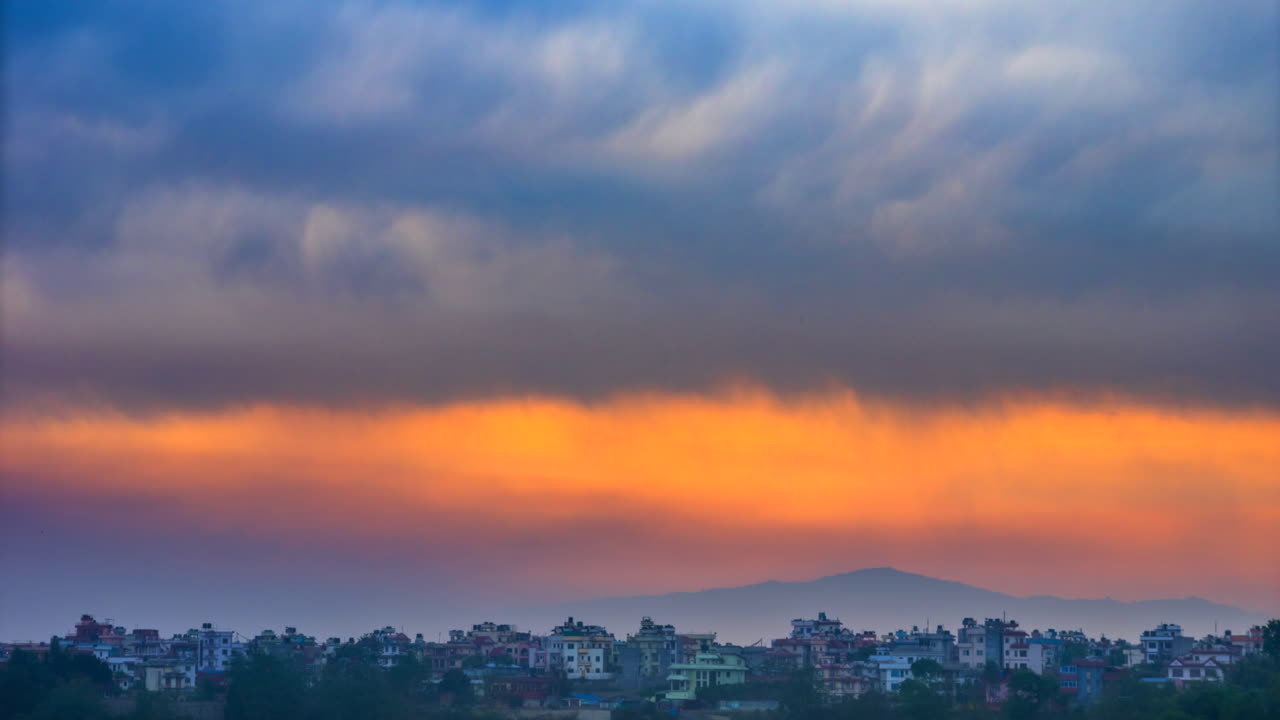 A sunrise time-lapse over the city of Kathmandu, Nepal during a thunderstorm.