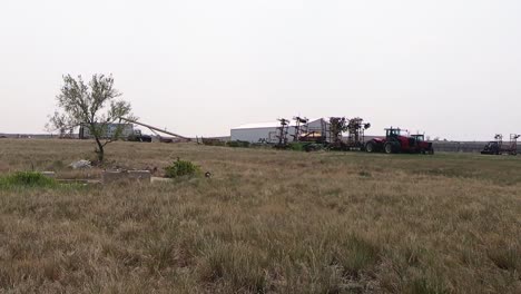 a farm and fields in the country during summer.