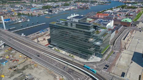 aerial around platinan building and the newly built hisingsbron bridge over gota alv river in gothenburg city, sweden