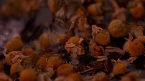 water pouring over dried herbal tea