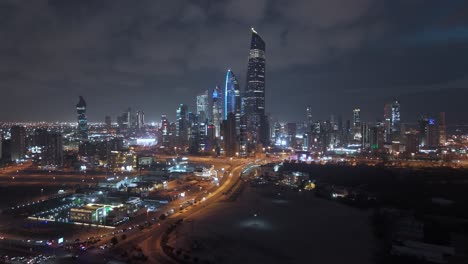 night cityscape, illuminated and flashing lights skyscrapers