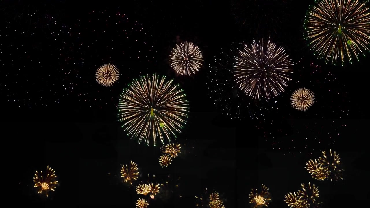 Beautiful golden big shiny fireworks with bokeh lights in the holiday night sky firework show