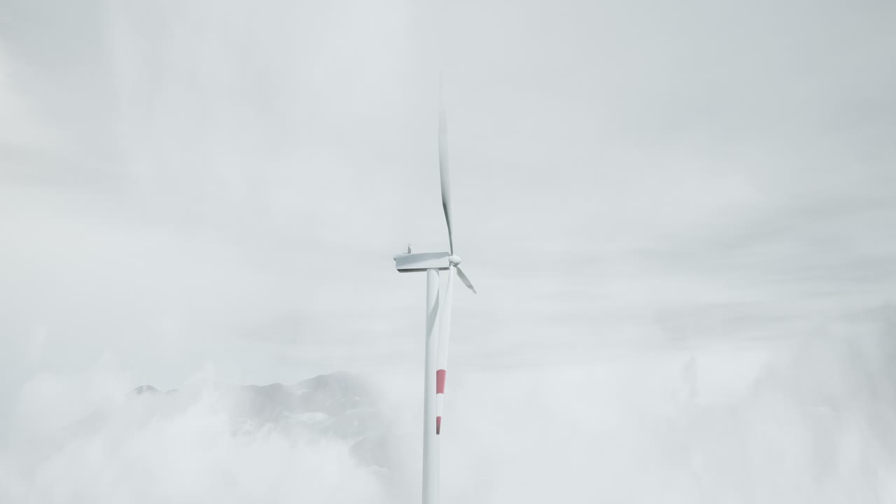 Wind Turbine in Foggy Mountain Landscape