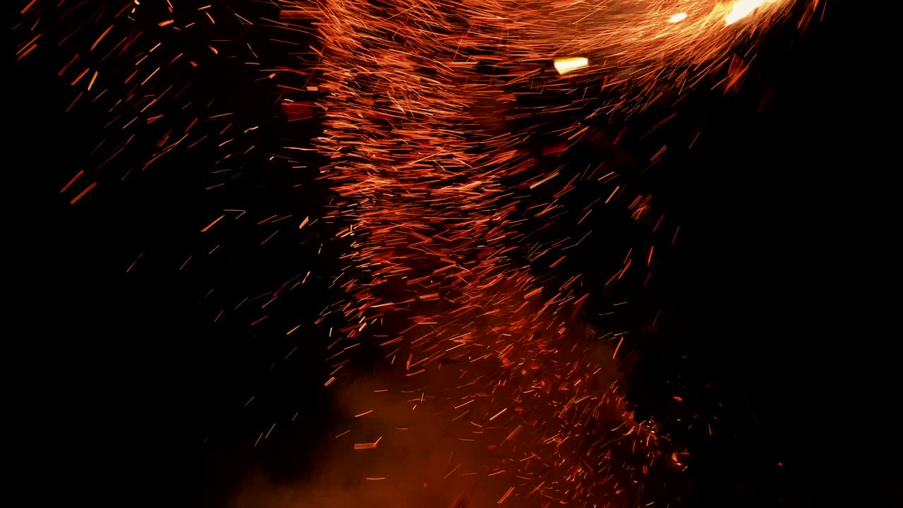 Stoking a bonfire with magical flying embers