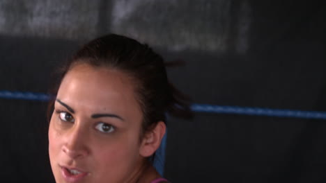 sporty focused brunette boxing