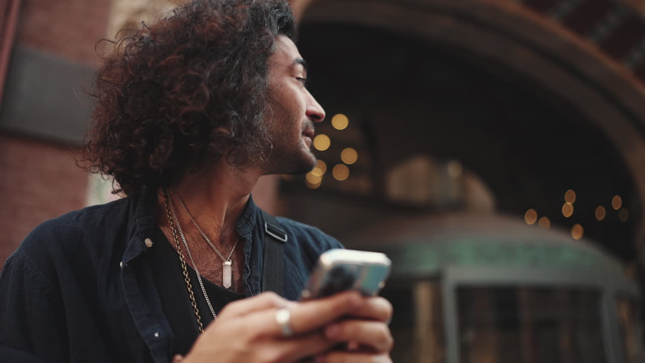 Man using phone outdoors