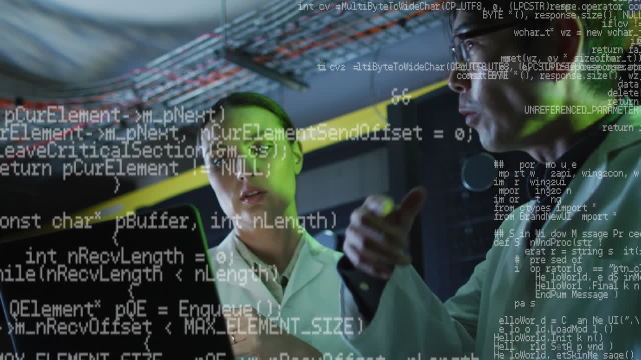 Animation of data processing over diverse woman and man working on laptop