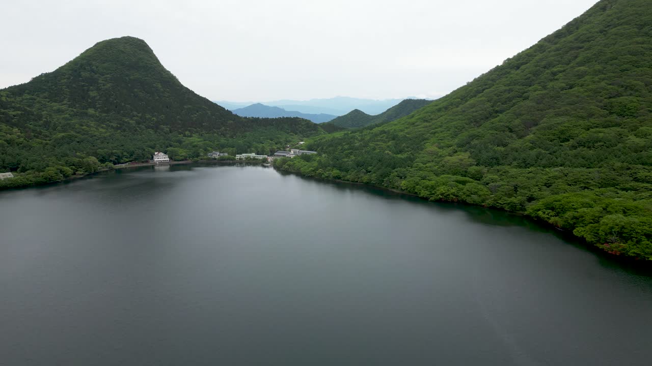 Stunning caldera lake in Gunma, Japan. Drone dolly in shot