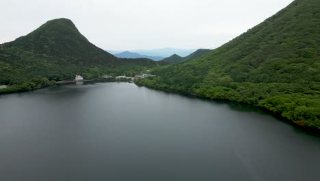 stunning caldera lake in gunma, japan. drone dolly in shot