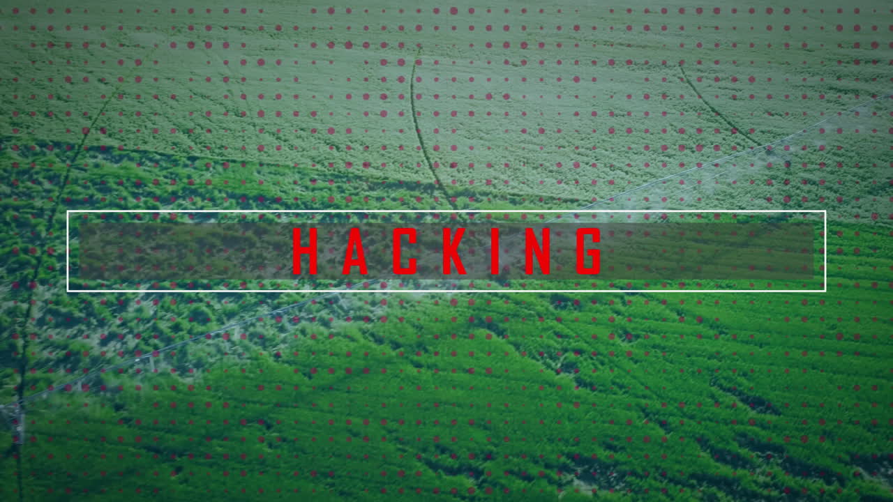 White rectangular overlay showing bold red HACKING text over aerial farmland, with red dotted grid